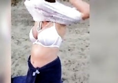 POV: U see as a breasty model—unaware of your presence—disrobes nude on the beach, bathes, and masturbates in the sand.
