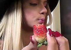 Blonde tranny with monster cock teases while eating strawberries
