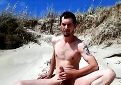 Exhibitionist Strokes Hard on the Beach