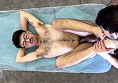 young hairy guy suffering during hair removal