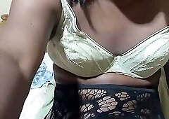 Naughty African crossdresser stroking her big black dick until she cums