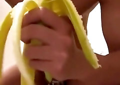 Naughty solo fucks herself with banana