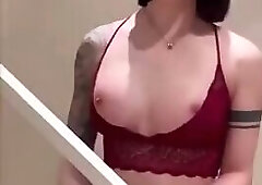 Gorgeous babe in red lace lingerie jerking her hard cock