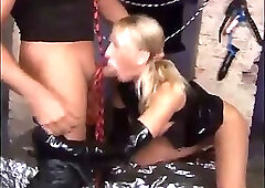 A couple in leather dress fucks very hard