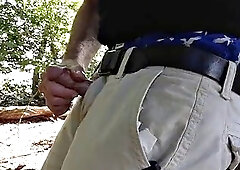 Im fighting in the woods with my blue boxers near a tree